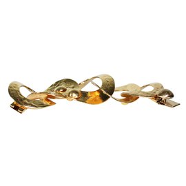 Bracciale Louis Vuitton in metallo dorato con grandi anelli