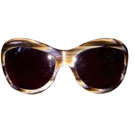Occhiali da sole Chanel in pelle trapuntata beige