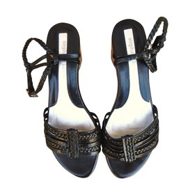 Sandali Stéphane Kelian in pelle intrecciata nera e legno