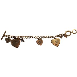 Braccialetto Guess con charm dorato in metallo