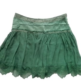 Falda corta Sandro Romance de seda verde y encaje