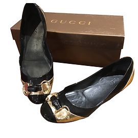 Gucci Ballerinas aus Leder Schwarz Gold