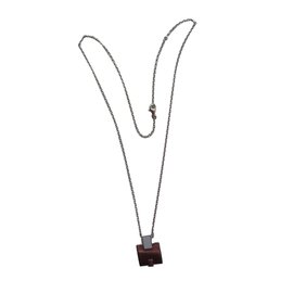 Collier pendentif H Hermès en acier argenté