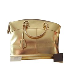 Louis Vuitton Lockit MM Suhali Bolso de mano de piel de cabra dorado metalizado