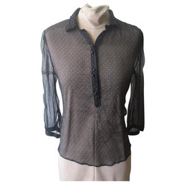Blusa Massimo Dutti de seda negra con mangas transparentes de lunares