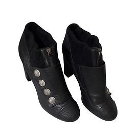 Botines Chanel de cuero acanalado y lana negro