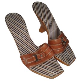 Mules Sergio Rossi in pelle marrone con tacco curvo