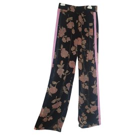 Autre Marque Pantalones Isabelle Blanche de terciopelo negro con estampado de flores