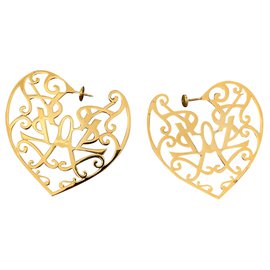 Boucles d'oreilles Yves Saint Laurent dorées argent