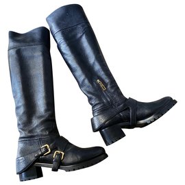 Botas de jinete Prada en cuero negro con hebillas doradas