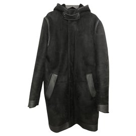 Givenchy hooded coat in black shearling lambskin with smooth leather insert in size 48 Ital.