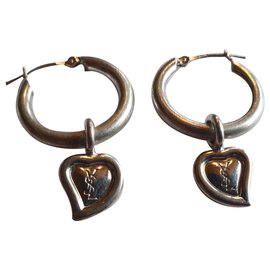Boucles d'oreilles créoles Yves Saint Laurent en argent