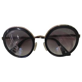 Gafas de sol Prada negras de acetato con detalles dorados