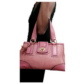 Borsa tote Coach Turnlock in pelle rosa