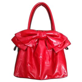 Sac à main Valentino Garavani Lacca Bow en cuir verni rouge