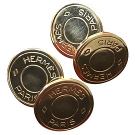 Gemelos Hermès dorados de metal