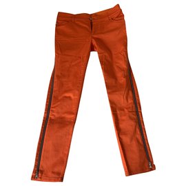 Pantalones Louis Vuitton con cremallera naranja