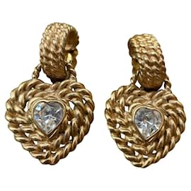 Boucles d'oreilles Yves Saint Laurent dorées en métal