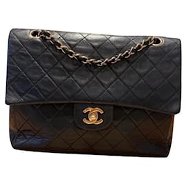 Borsa a mano Chanel Timeless in pelle blu navy con finiture oro