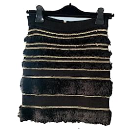 Falda Balmain de tweed negra con costuras doradas