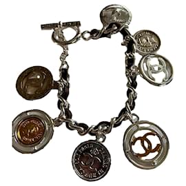Braccialetto con ciondoli Chanel in acciaio argento e oro