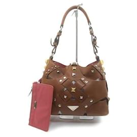Borsa Prada Nocciolo Vitello in pelle marrone con borchie
