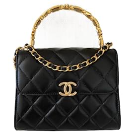 Chanel Bolso con solapa de piel de cordero negra con asa superior Clutch