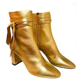 Bottines Yves Saint Laurent Lou en cuir doré