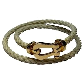 Bracciale Fred Force 10 in oro giallo e cordino