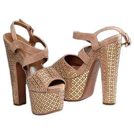 Sandali Alaïa in pelle oro e camoscio beige