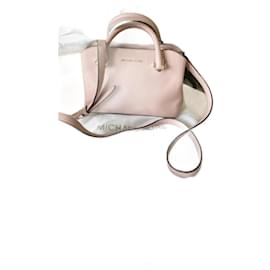 Borsa Michael Kors in pelle rosa con dettagli dorati