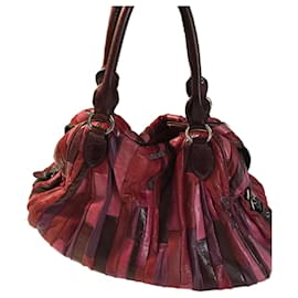 Borsa Miu Miu in pelle fucsia e melanzana