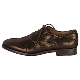 Zapatos metalizados con cordones de Paul Smith