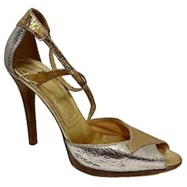 Goldene und silberne Sandalen mit hohen Absätzen von Casadei