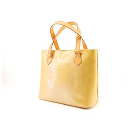 Louis Vuitton Houston in vernice dorata/jaune