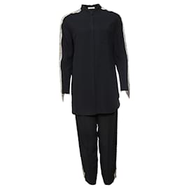 Chloe, Pantalón azul oscuro (36/XS) y blusa (38/S) con bordado plateado a lo largo de las mangas y las piernas. - Chloé