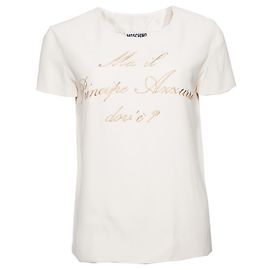 MOSCHINO COUTURE, Top color crema con texto dorado.