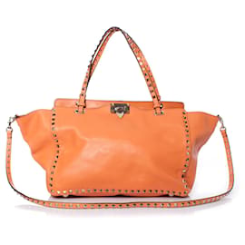 Valentino Garavani, Borsa tote Rockstud Trapeze arancione.