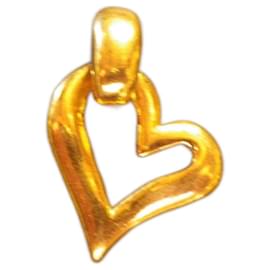 Collier pendentif Yves Saint Laurent en métal doré