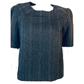 Top Maje con paillettes nero a maniche corte