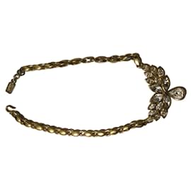 Collier ras du cou Yves Saint Laurent motif floral doré