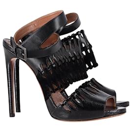 Sandali AlaÏa con cinturino alla caviglia ritagliati in pelle nera - Alaïa