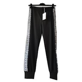 GIVENCHY PANTALONE JOGGING BLACK EDITION 4G TAG BANDE LATERALI. - Givenchy
