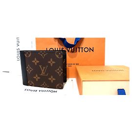 Louis Vuitton Portafoglio multiplo in pelle nera e tela monogram.