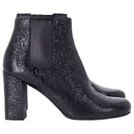 Botines Chelsea de tacón alto Saint Laurent en cuero negro
