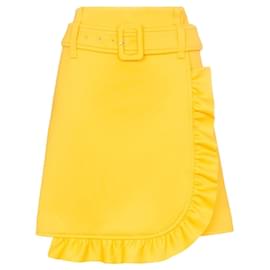 Minifalda Prada de crepé amarillo con cinturón