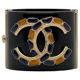 Bracciale manchette Chanel CC oro e metallo nero
