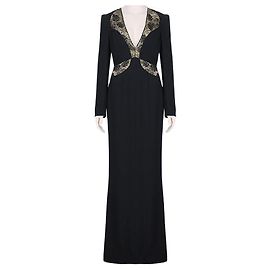 Vestido largo de Alexander McQueen en negro y dorado con detalles de encaje.