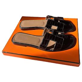 Mules Hermès in pelle di alligatore nera