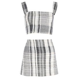 Conjunto de minifalda y top a cuadros de Reformation en lino gris